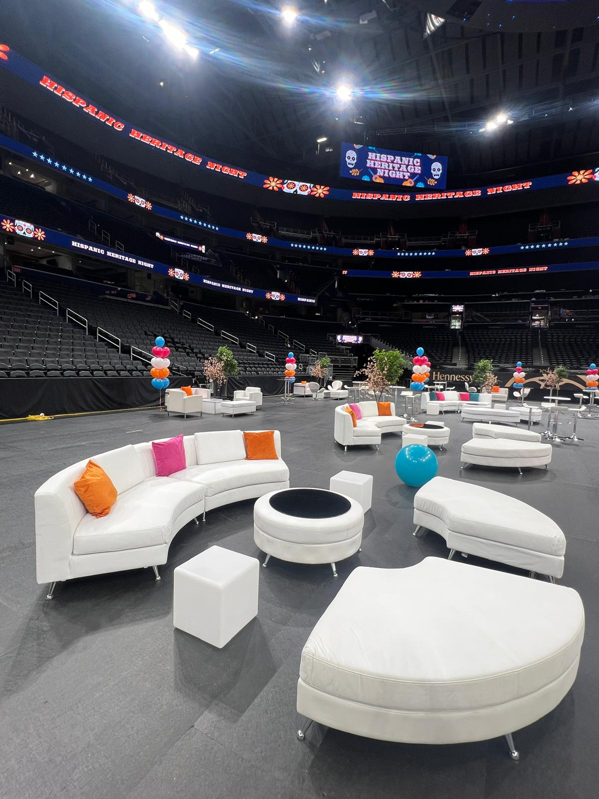 Monumental Sports VIP hospitality lounge with curved white leather sofas on the Capital One Arena floor Monumental Sports VIP hospitality lounge with curved white leather sofas on the Capital One Arena floor